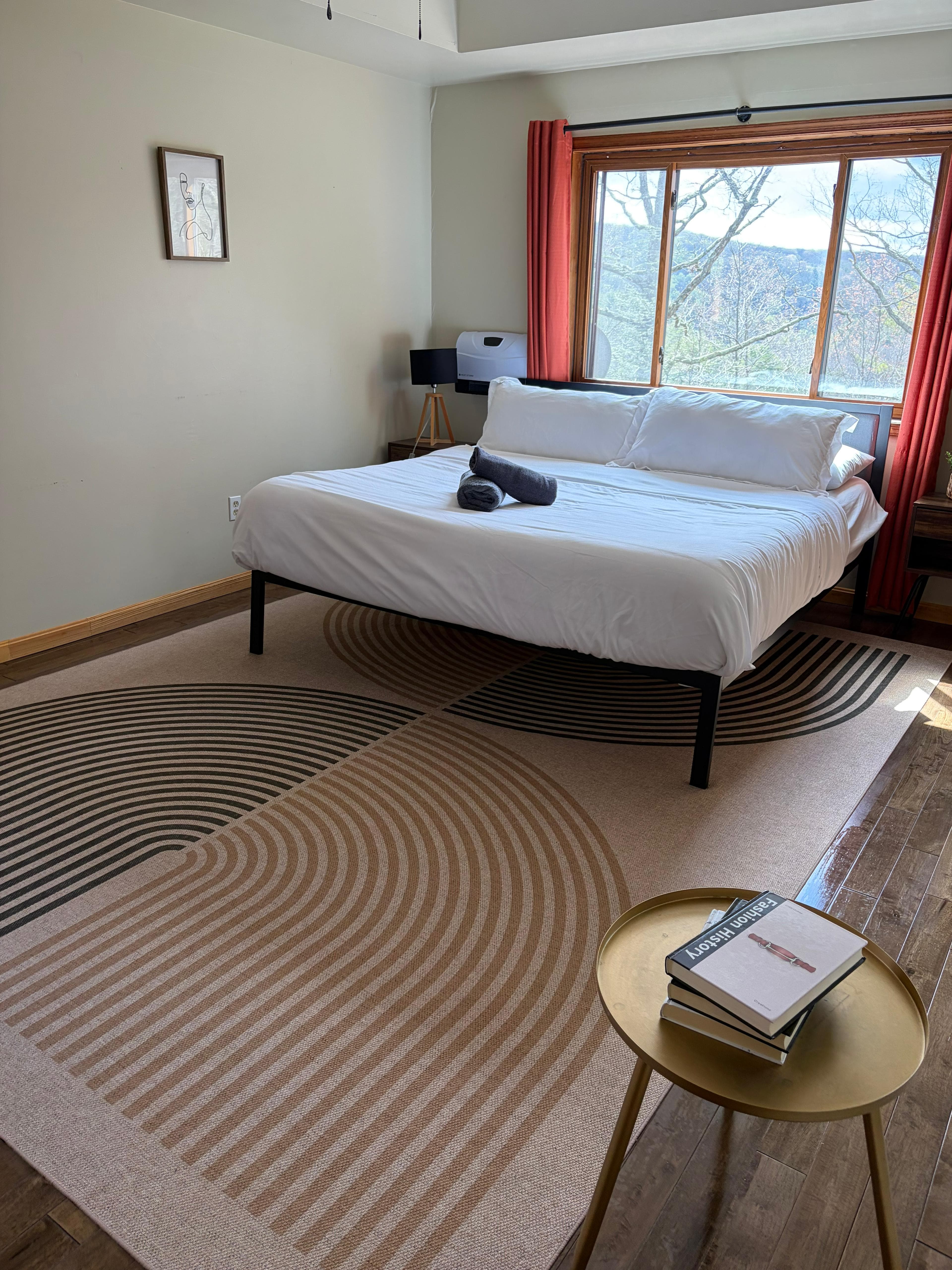 Hotel-quality bedroom finish with rolled towels — ready for the post-clean report